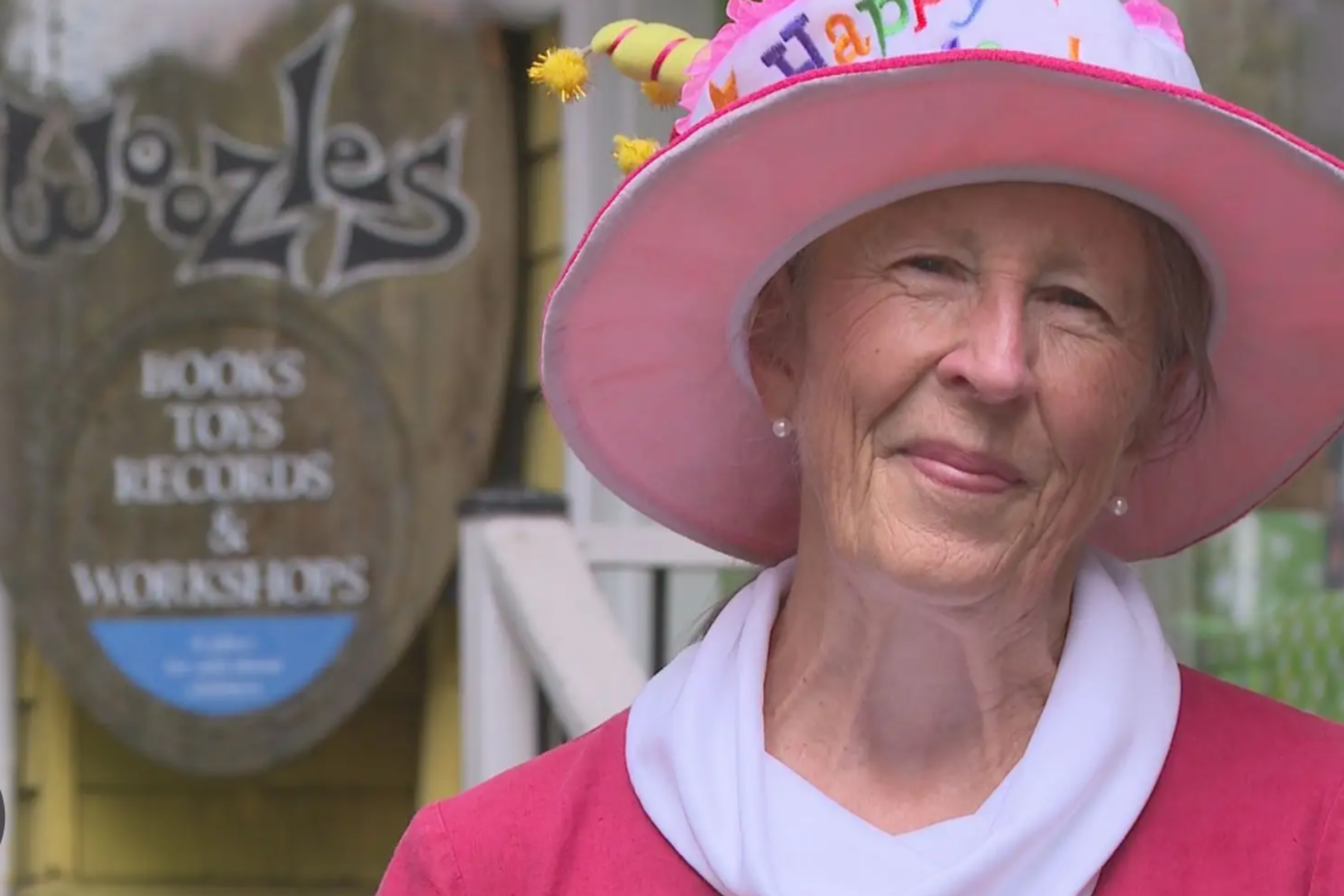 Woozles Co-Founder, Liz Crocker, is photographed in front of the original location, opened in 1978