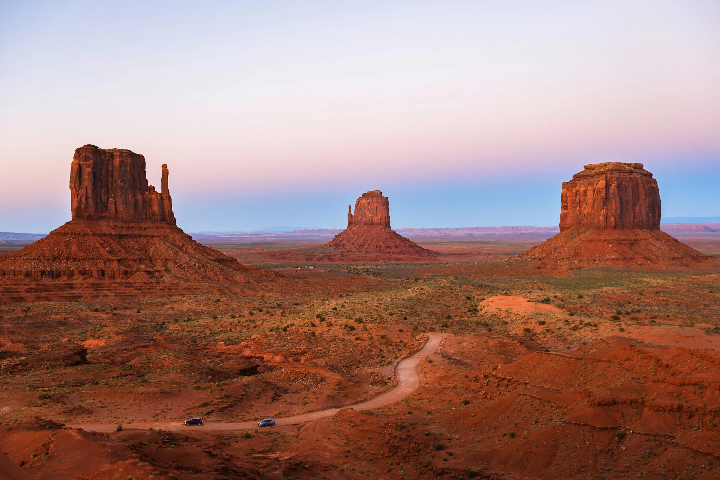 Panoramic view of the monolithic rock formations of Monument Valley at dusk