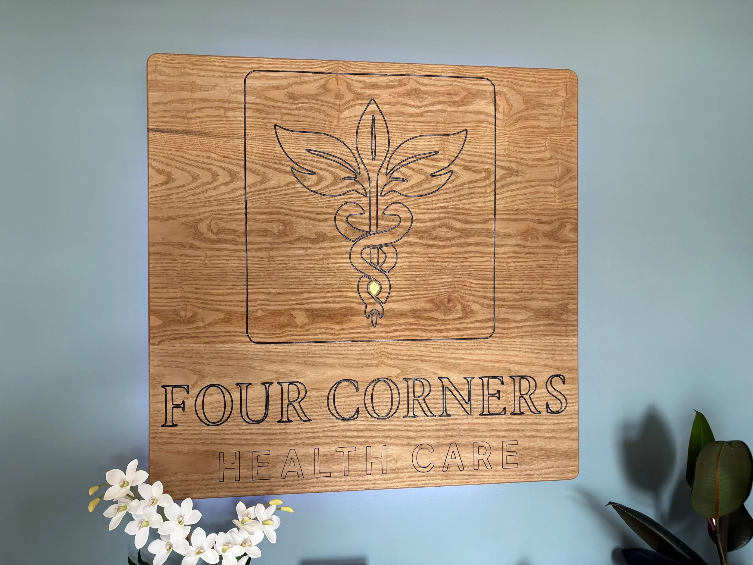 Custom-engraved business sign made from oak