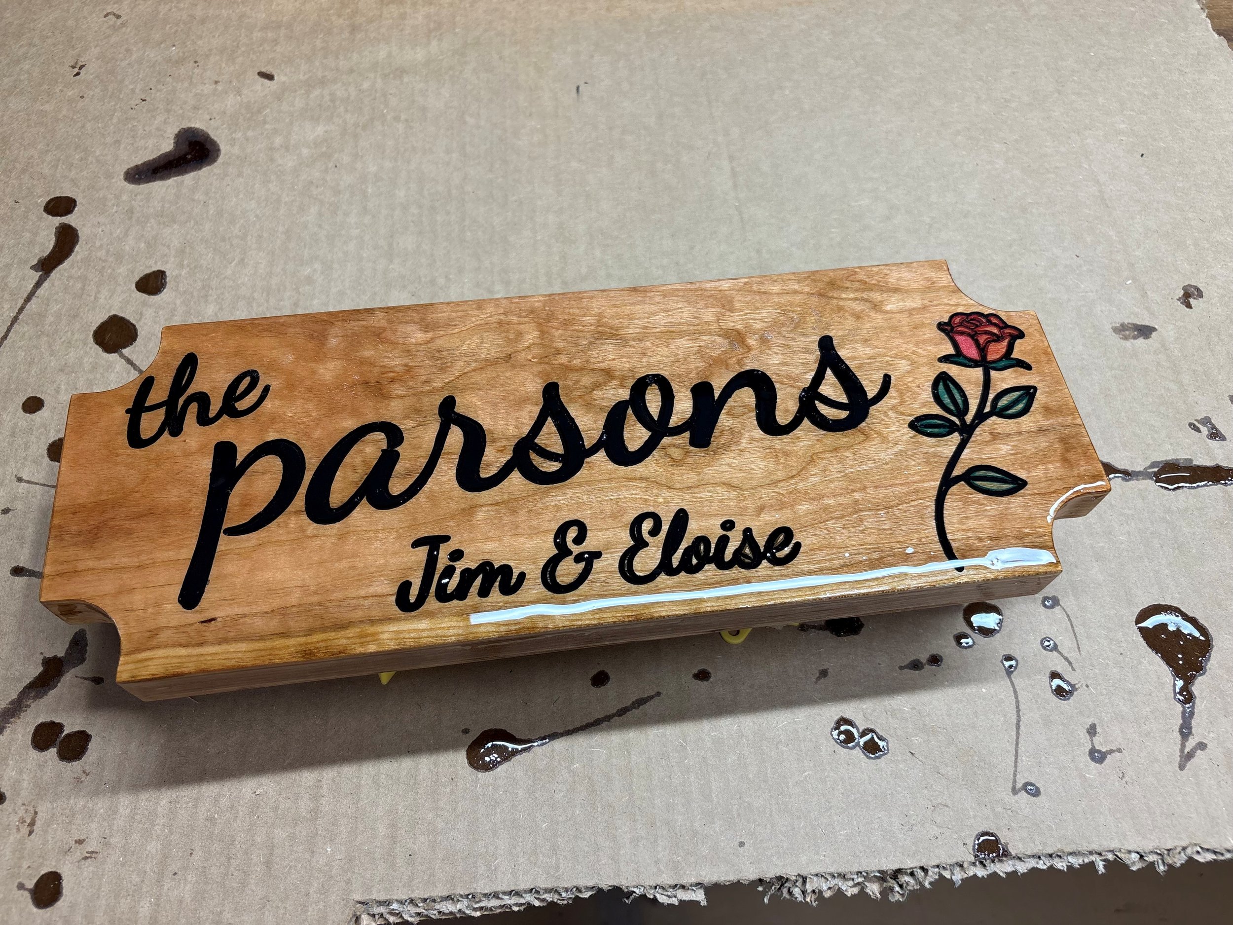 Custom- engraved family house sign made from cherry and finished with epoxy 