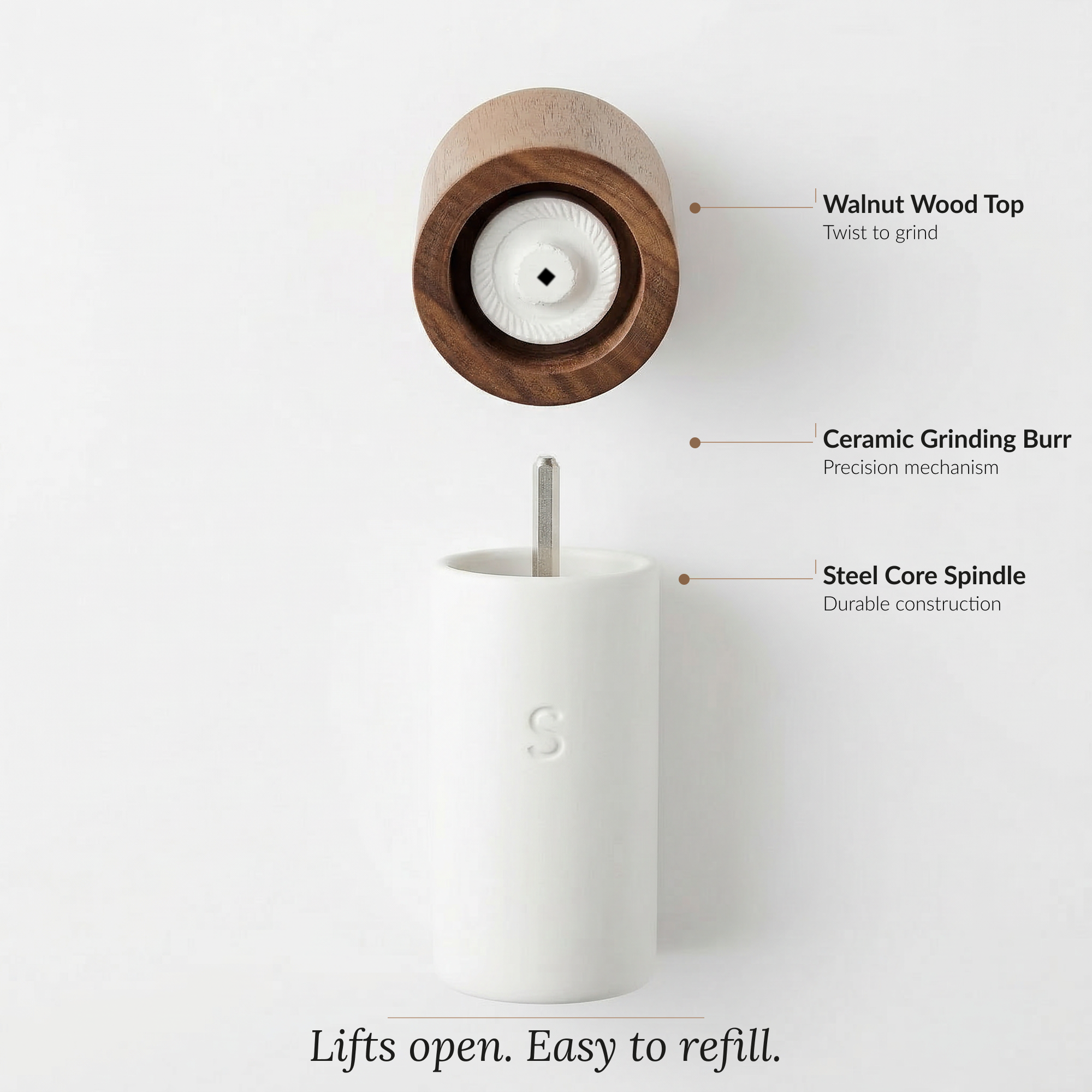 A kitchen paper towel holder with a wooden top, ceramic grinding burr, and a steel core spindle, showing the features that make it easy to refill.