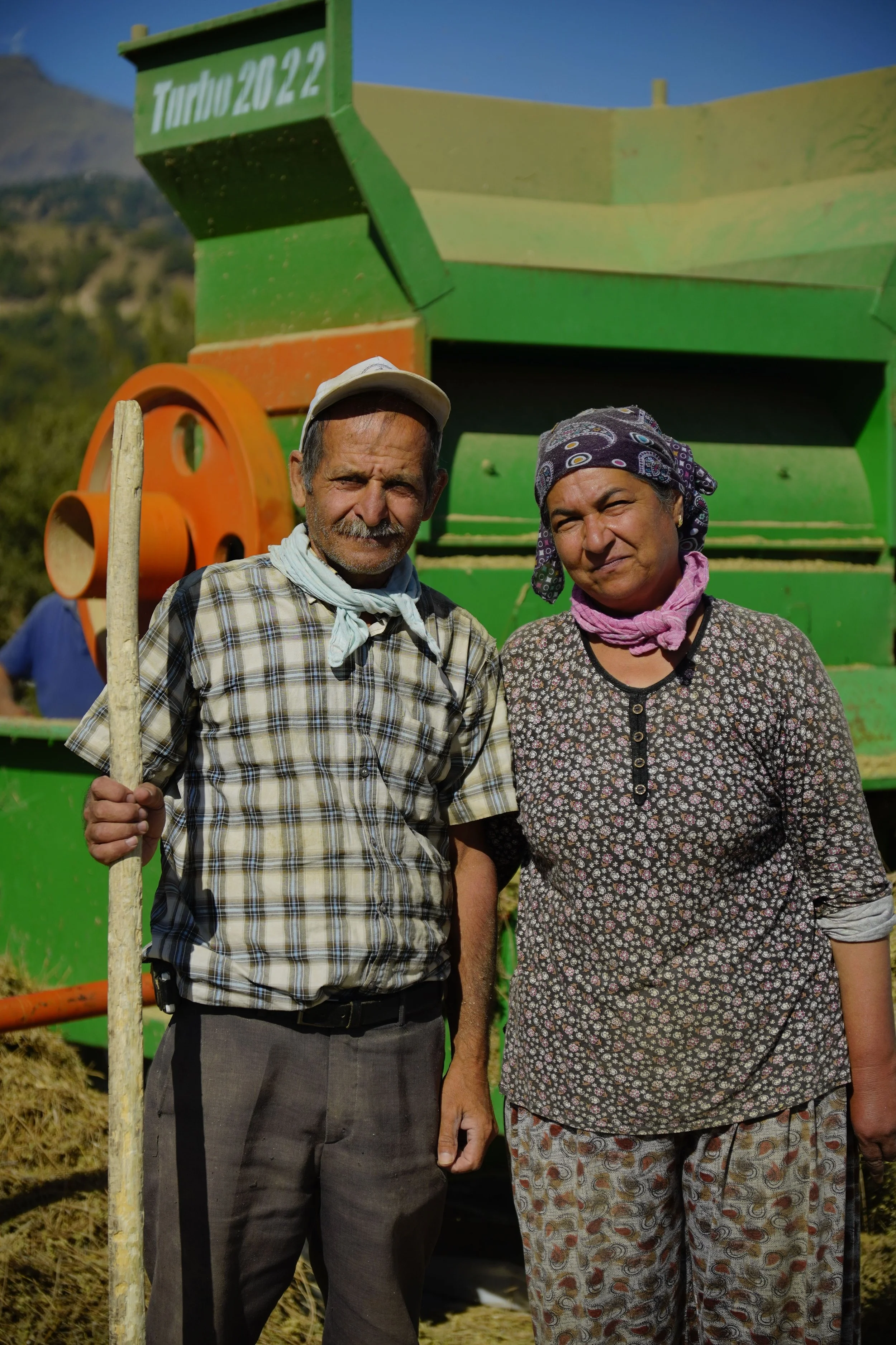 Farmers with agricultural equipment representing community-led agricultural solutions