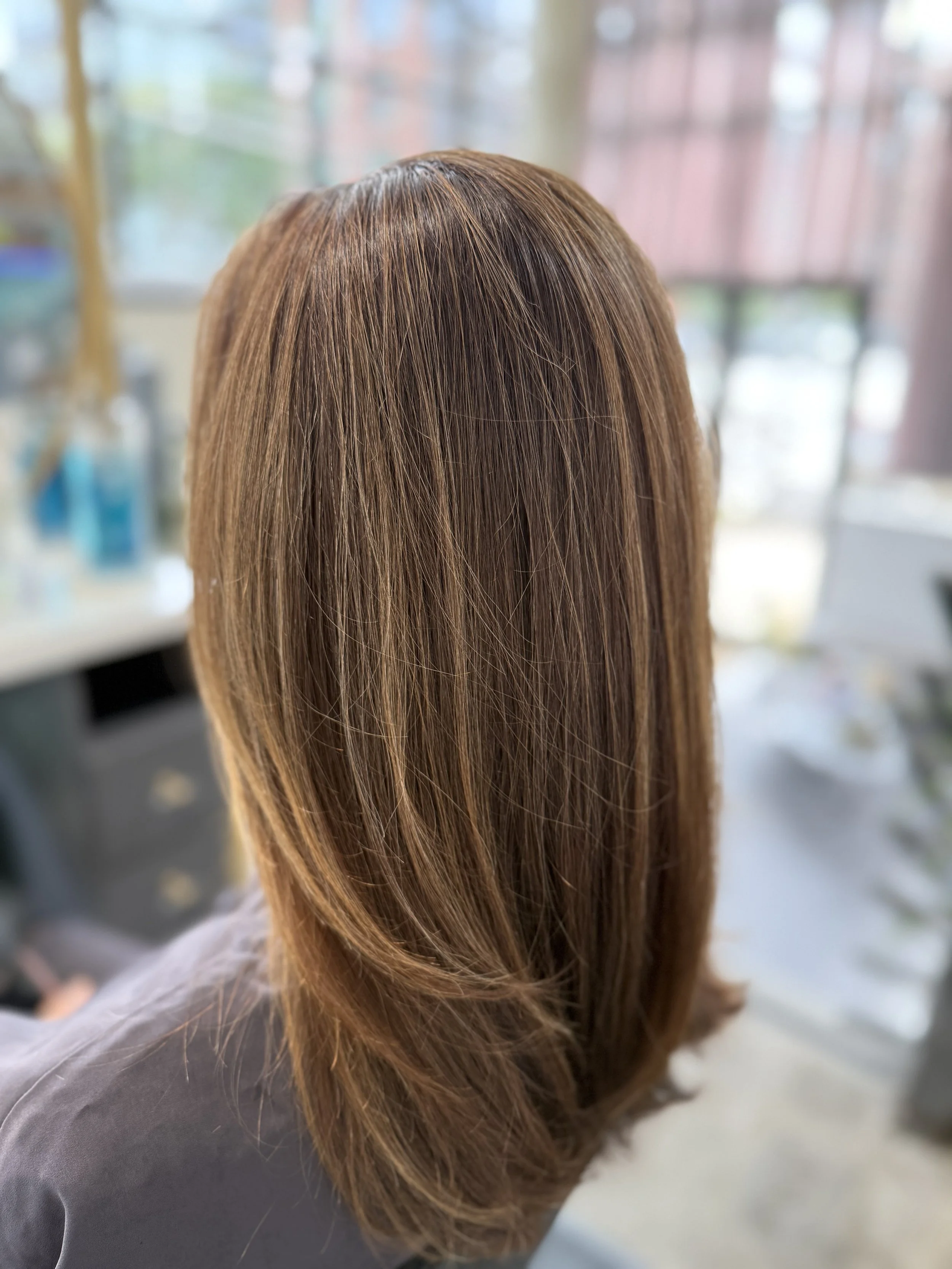 Before and After of Grey Blending in Brooklyn. Low maintenance grey hair color with dimensional blending at Greenpoint Brooklyn salon