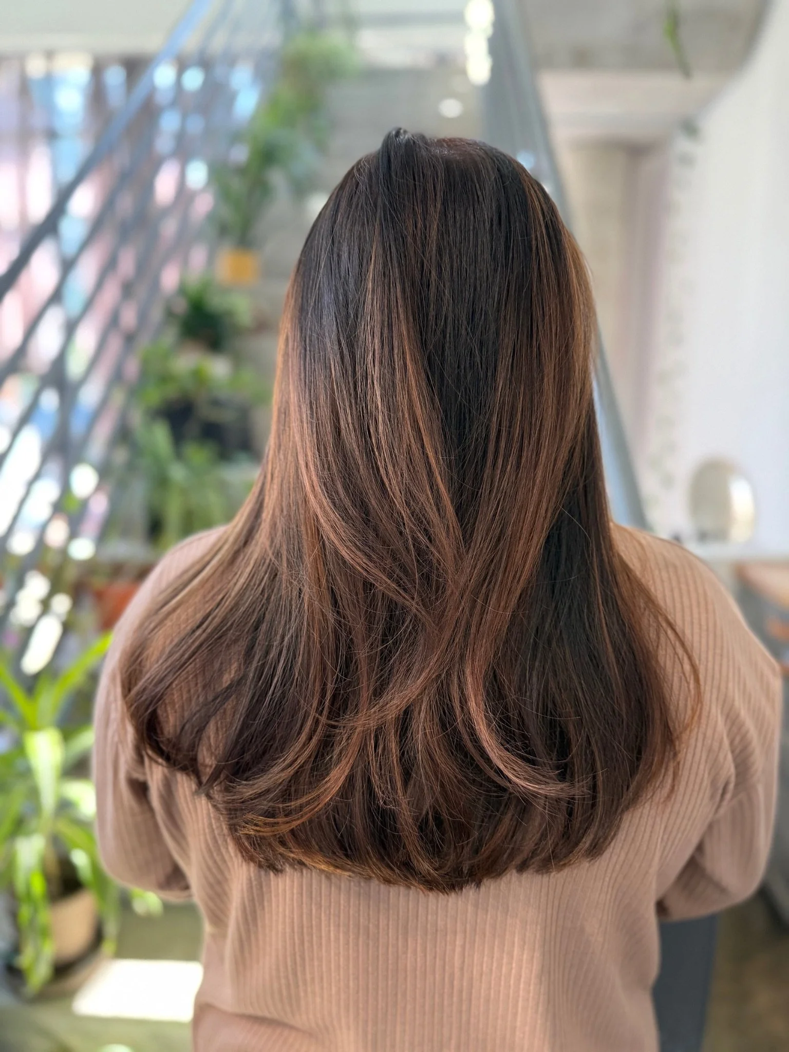 Teddy Bear Brunette hair color with warm chocolate and caramel tones by Gem House Salon in Greenpoint Brooklyn.