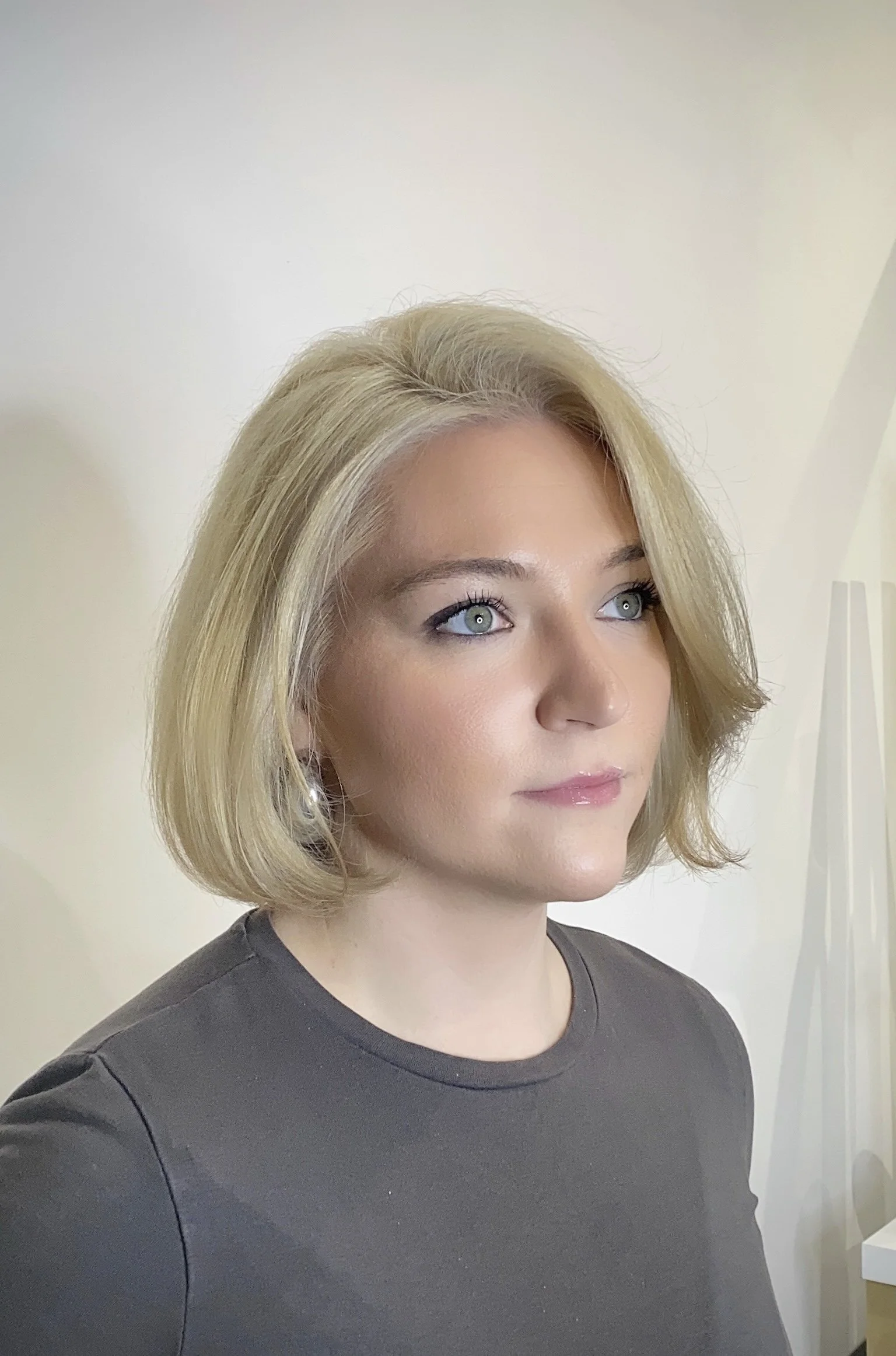 After photo of platinum hair color transformation created at Gem House Salon in Greenpoint Brooklyn near Williamsburg and Long Island City with tips on caring for blonde hair.