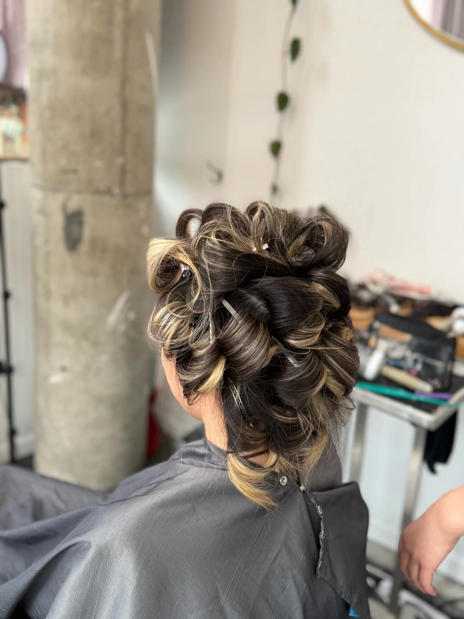 90s inspired blowout with soft volume and bouncy movement created with rollers at a Greenpoint Brooklyn hair salon.