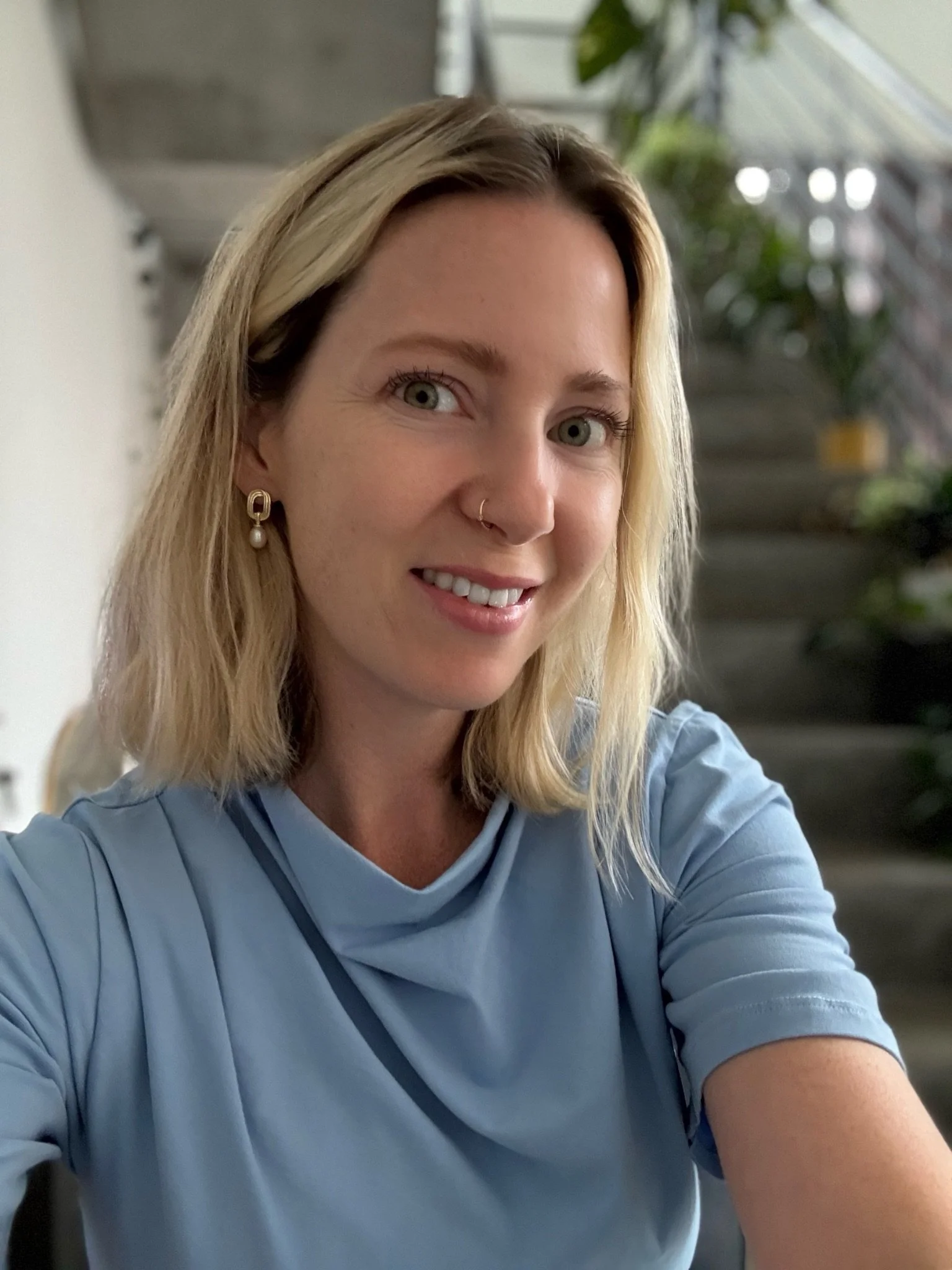 Buttercream Blonde hair color with soft neutral-golden tones by Gem House Salon in Greenpoint Brooklyn.