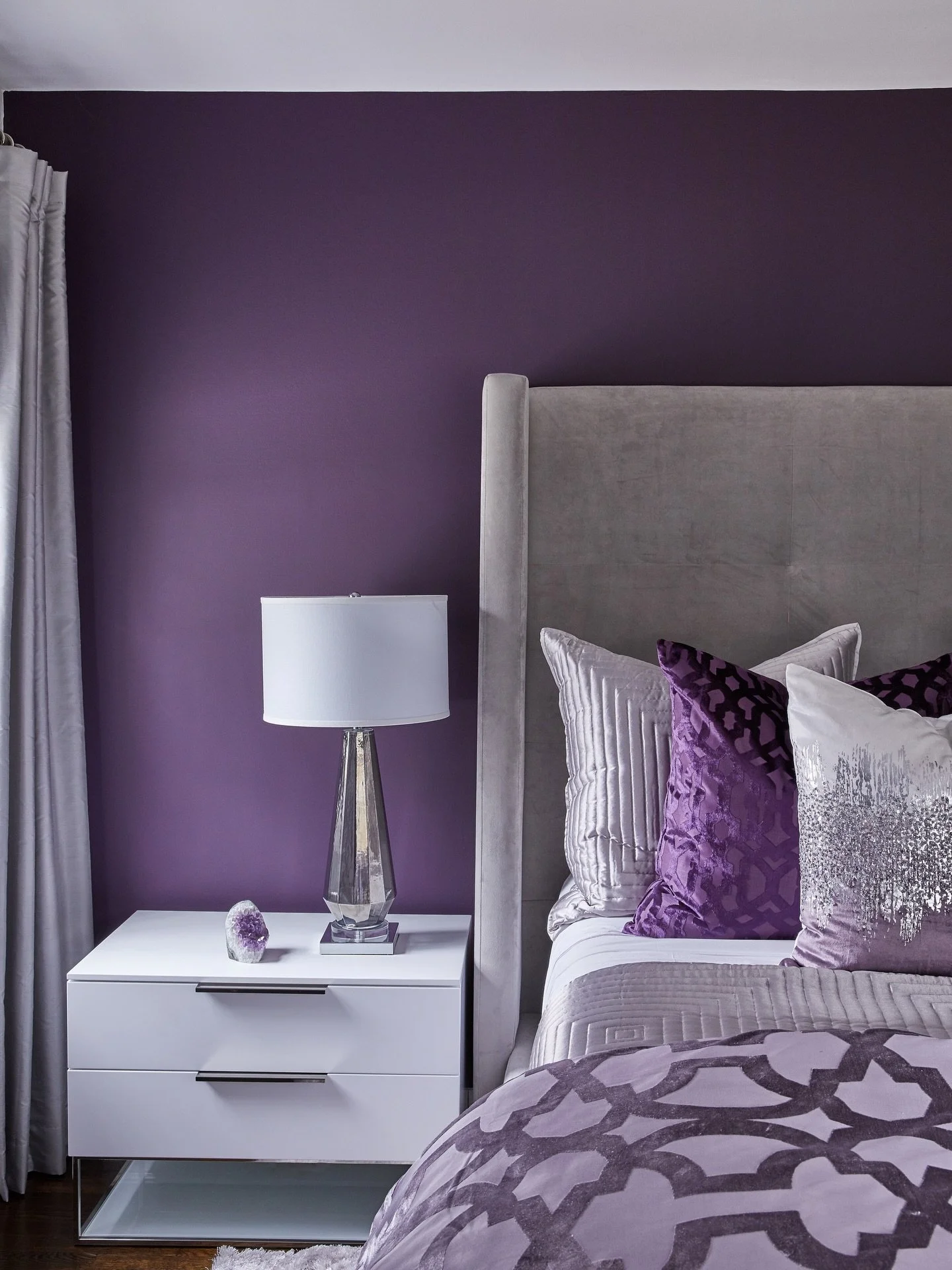 Luxury interiors often emerge from a clear and confident color story. 

This primary bedroom suite illustrates the power of a disciplined monochromatic palette. Every element works within one color family, letting shades, tints and tones of Plum, Lav