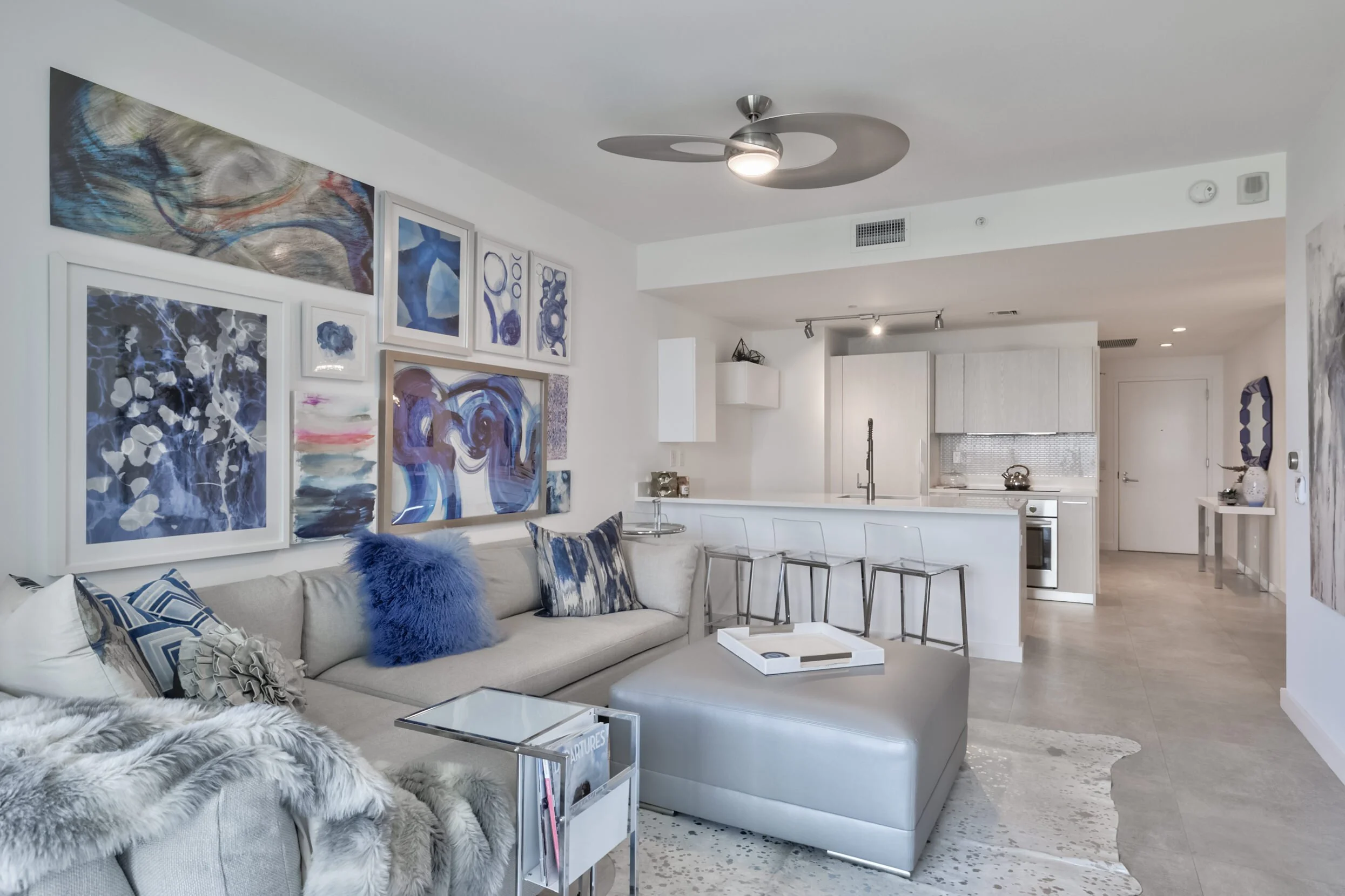 Living Room Space Using Cowhide Rug to Add Pattern and Texture Into Design.