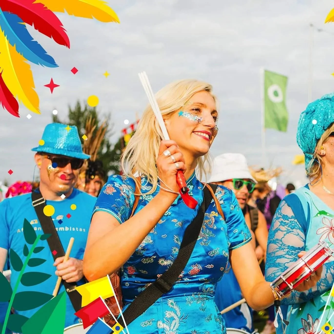 Group of people at a celebration parade, dressed in colorful, festive clothing, with confetti and decorations around.