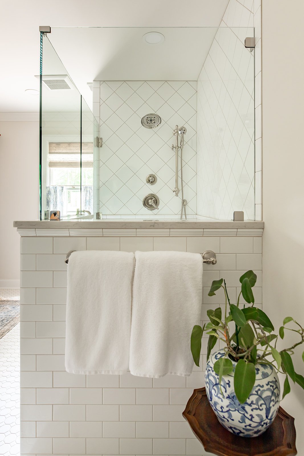 Oversized walk-in shower with a built-in bench