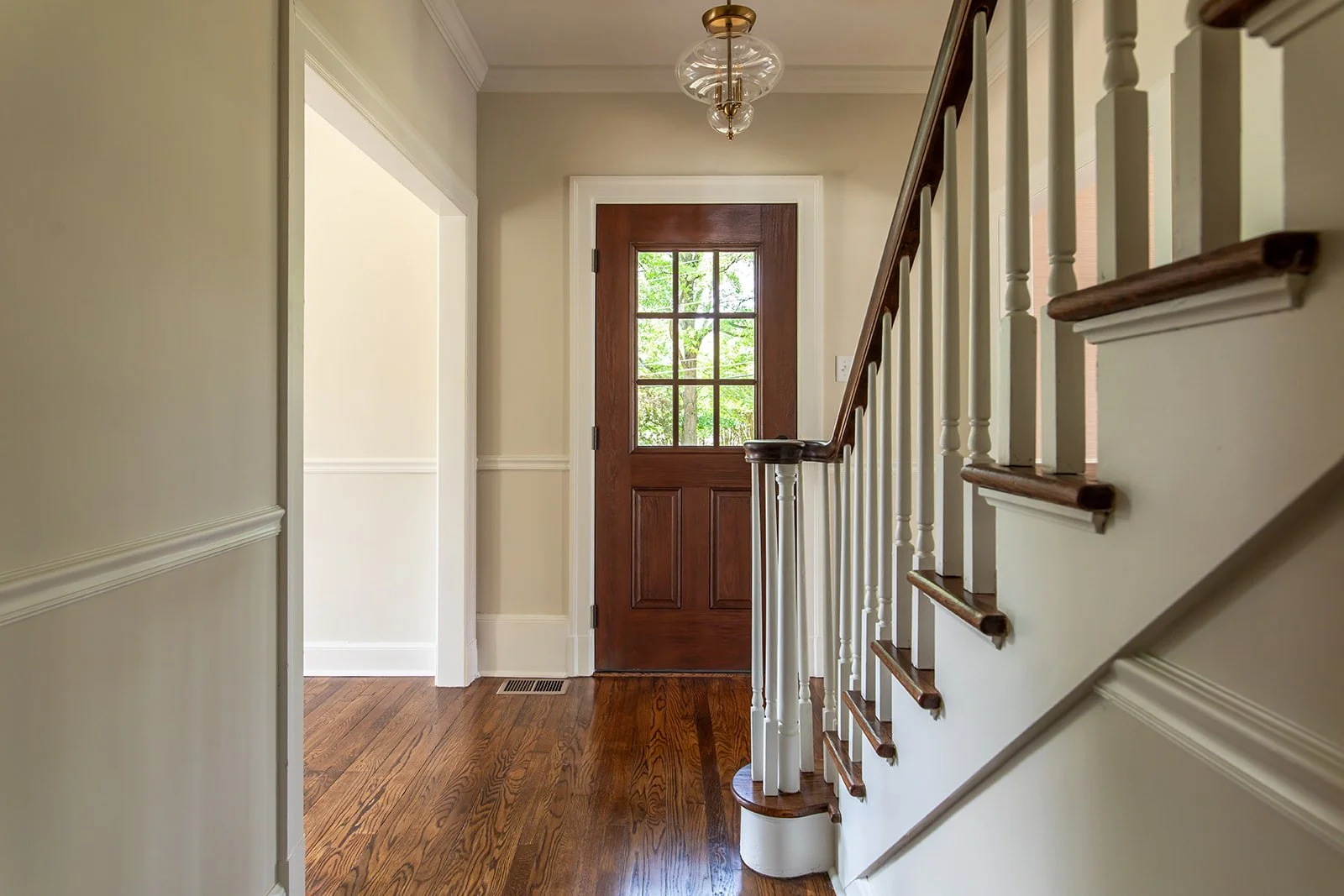 Entry foyer wrapped in original millwork