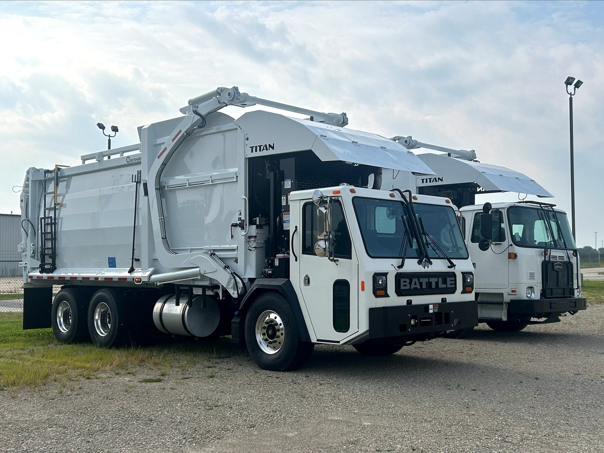 Battle Motors LET 2 garbage truck with Curbtender Titan read loading body