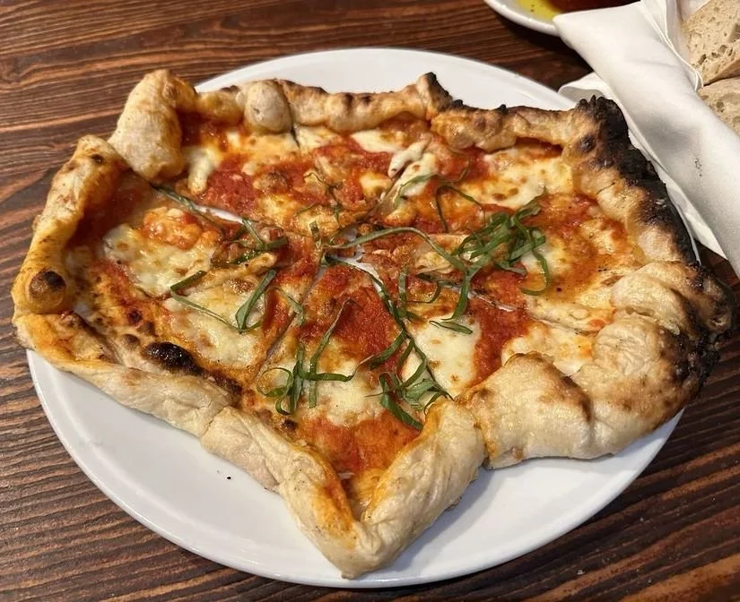 Margherita Pizza with tomato sauce, mozzarella, tomato slices & basil