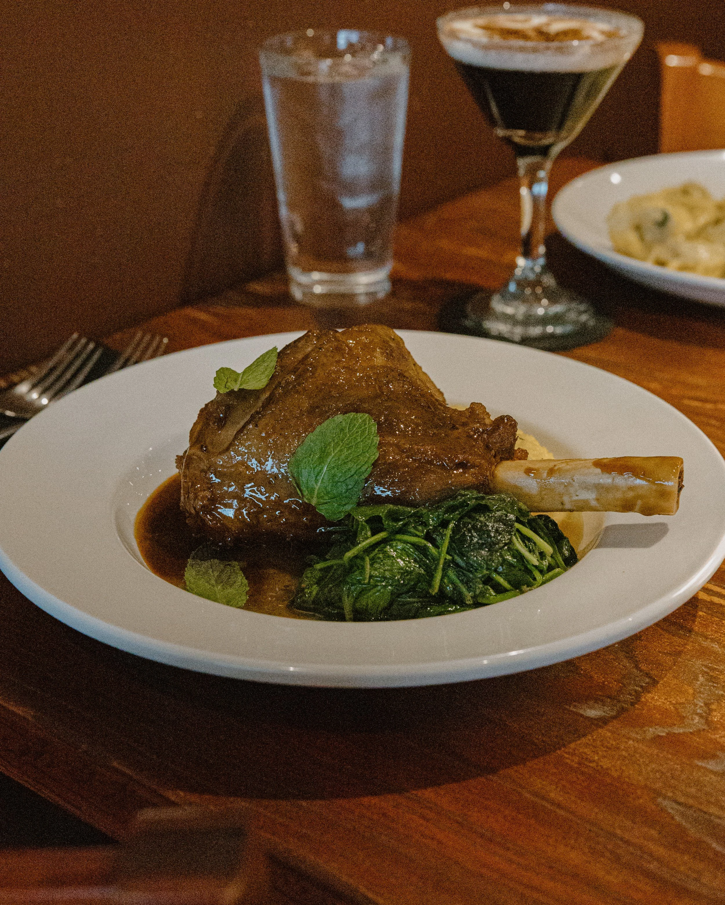 Lamb shank, creamy polenta, spinach, and a delicious sauce that pulls it all together.