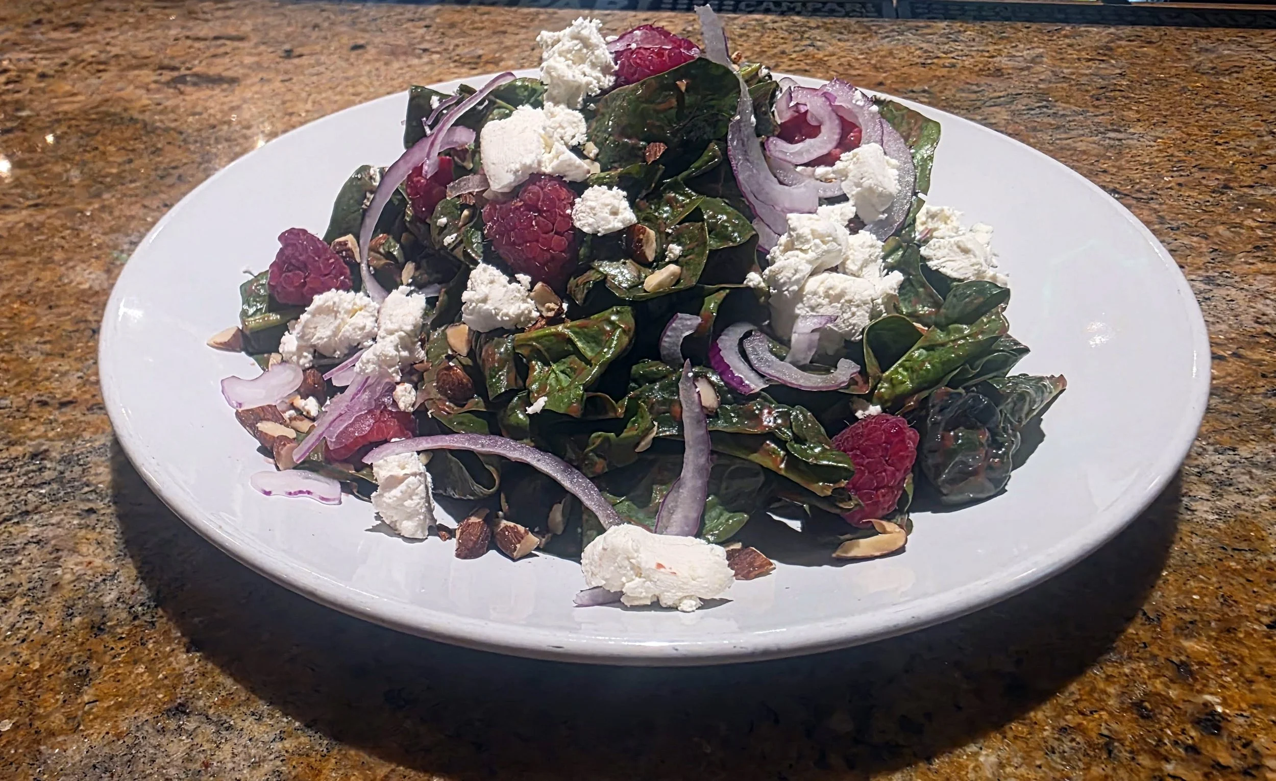 Spinach Salad with Goat Cheese, Toasted Almonds, Raspberries & Raspberry Balsamic Vinaigrette