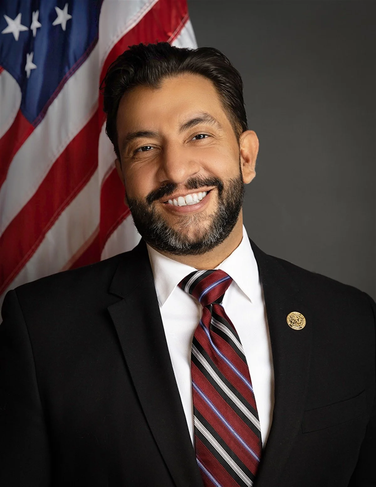 Paul Lopez smiles at the camera