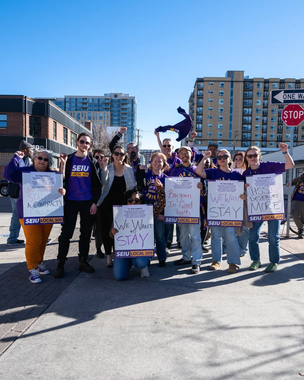 Amanda Gonzalez with SEIU Local 105 members holding signs on a picket line