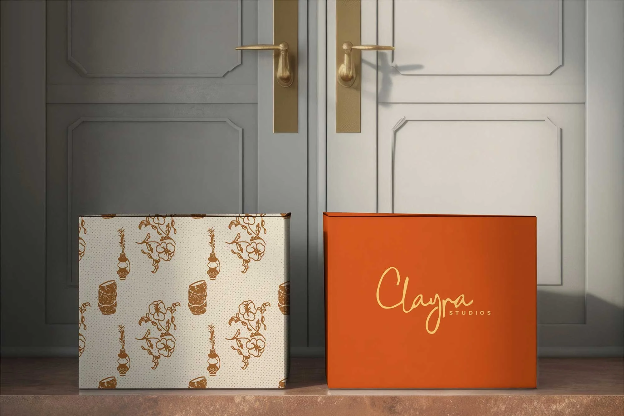 Close-up of two gift boxes: one featuring a custom brand pattern and the other showcasing the brand logo with primary colors, highlighting cohesive branding elements.