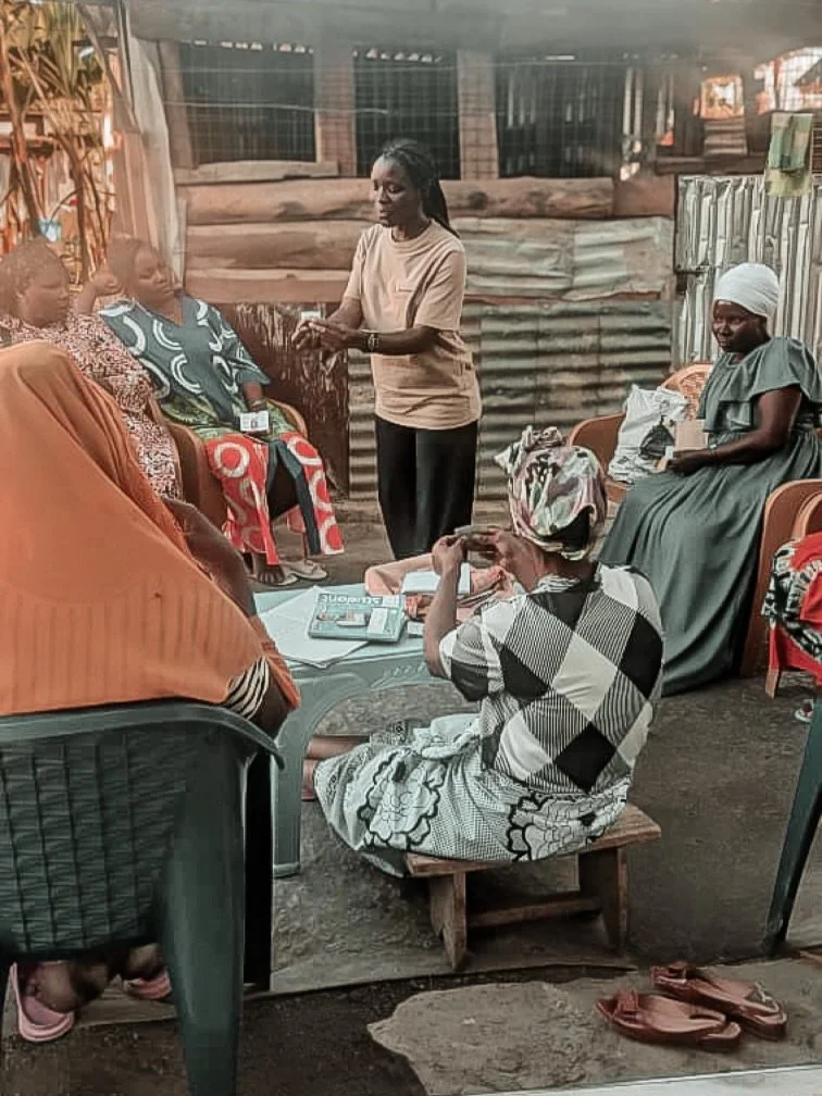 Here is Neema at a local Vikoba women&rsquo;s group, leading an open and honest conversation about menstrual health. She&rsquo;s demonstrating how to fold and correctly insert a menstrual cup, answering questions, and helping the women feel confident
