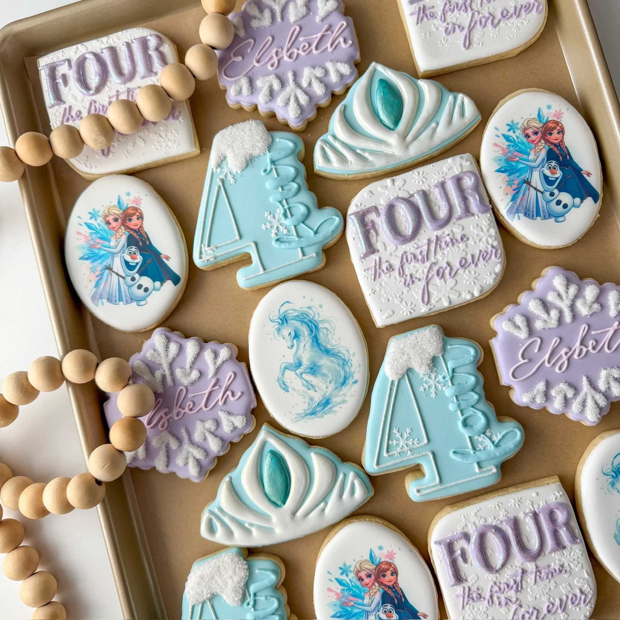 A birthday set worth melting FOUR 🤍❄️🍪 #frozen #disney #frozenbirthday #decoratedsugarcookies #northcarolinacookies