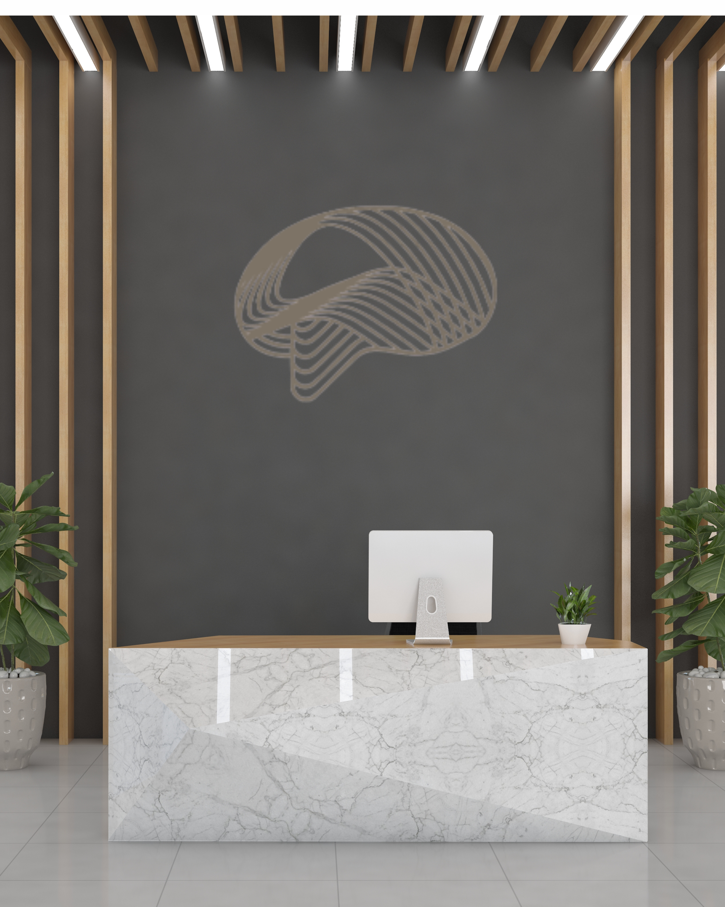 Modern office reception area with a white marble desk, a computer monitor, a small potted plant, and two large green plants in textured pots. A dark gray wall features a metallic abstract brain logo, and the ceiling has wooden beams with integrated lighting.