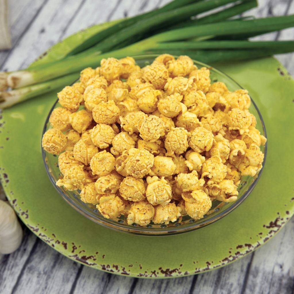 ZESTY RANCH-
This popcorn tastes just like your favorite name brand ranch chips… but in popcorn form. Experience a blast of tanginess with hints of onion, garlic, tomato and spice blended together in a creamy, ranch popcorn. Gluten Free.