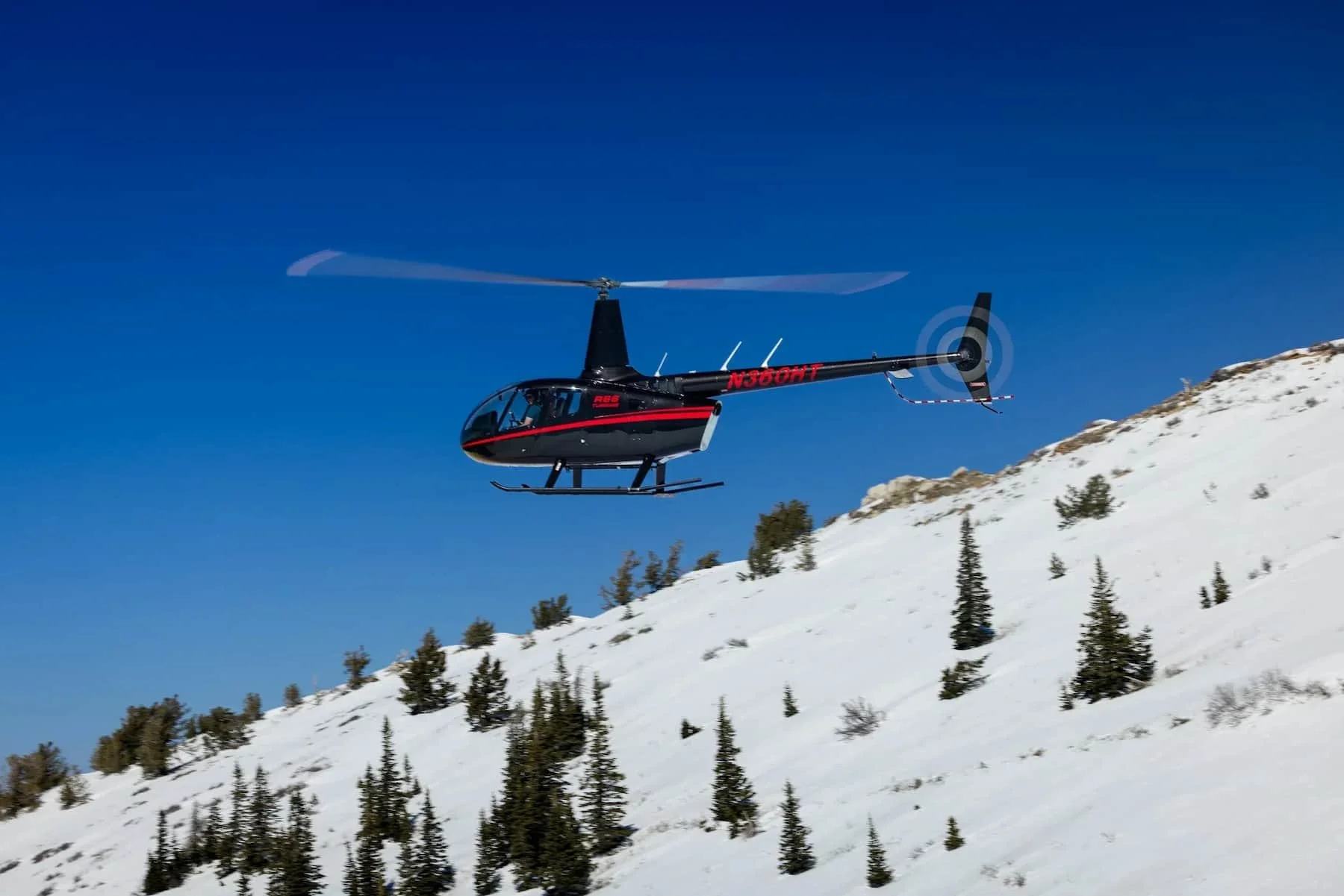 Robinson R66 in flight over the Wasatch Front