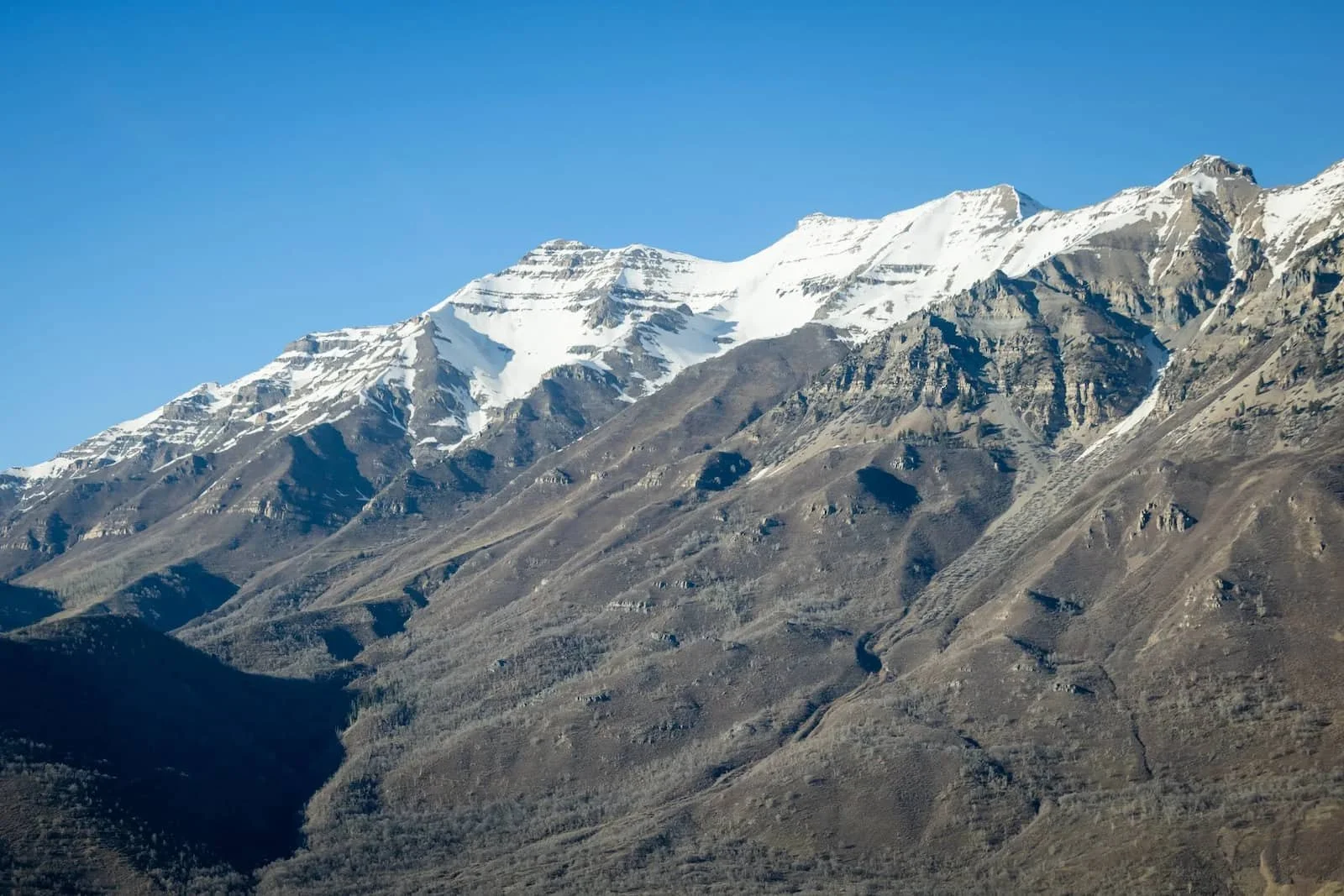 Snow-covered Wasatch peaks seen from the cockpit