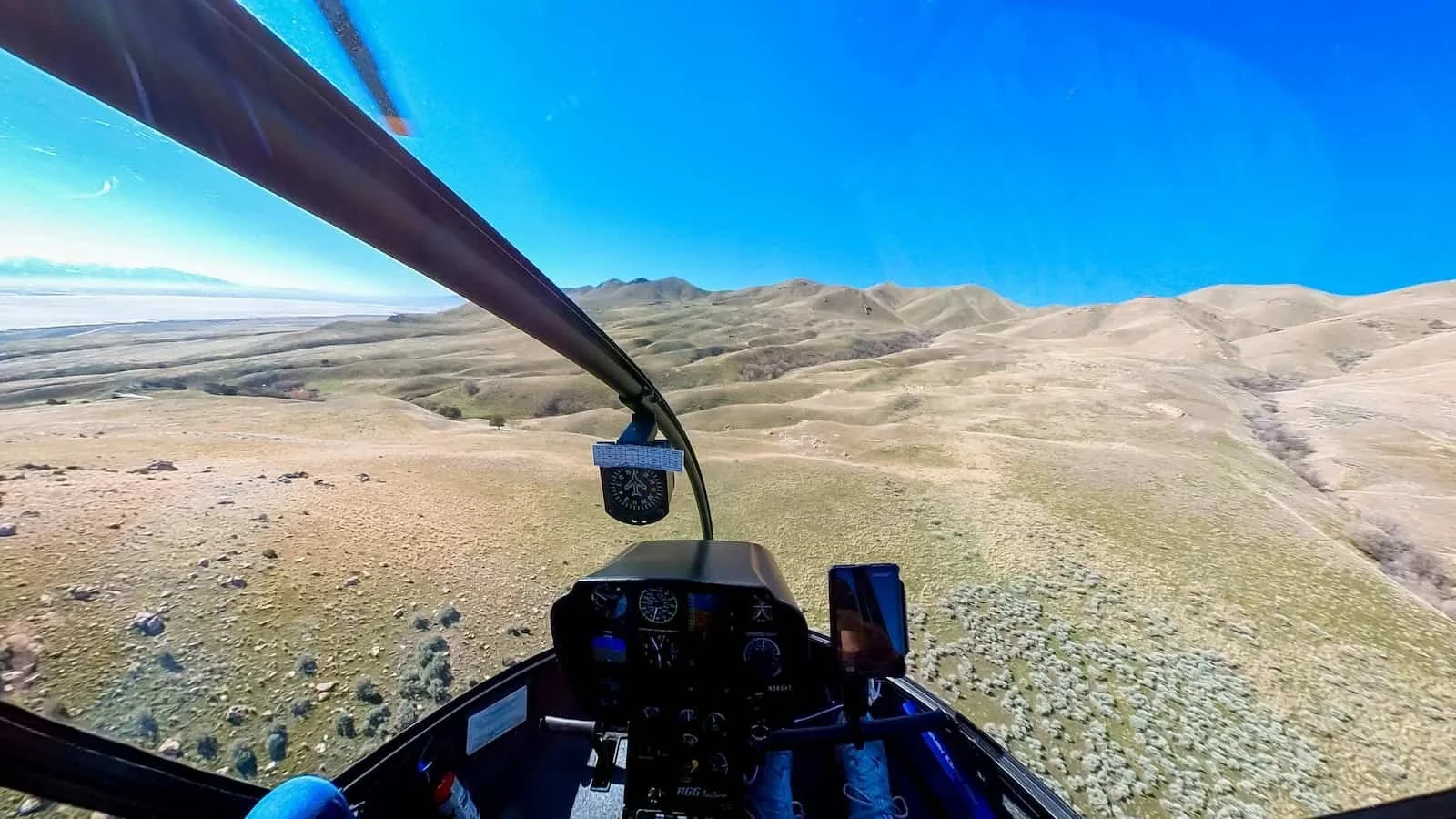 Panoramic aerial view of the Salt Lake Valley stretching toward the surrounding mountain ranges.