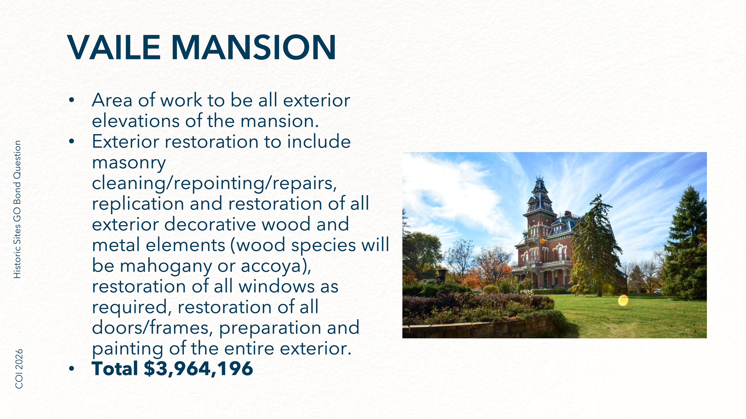 A historic mansion called Vail Mansion with a Victorian architectural style, surrounded by lush greenery and a well-maintained garden, under a partly cloudy blue sky.
