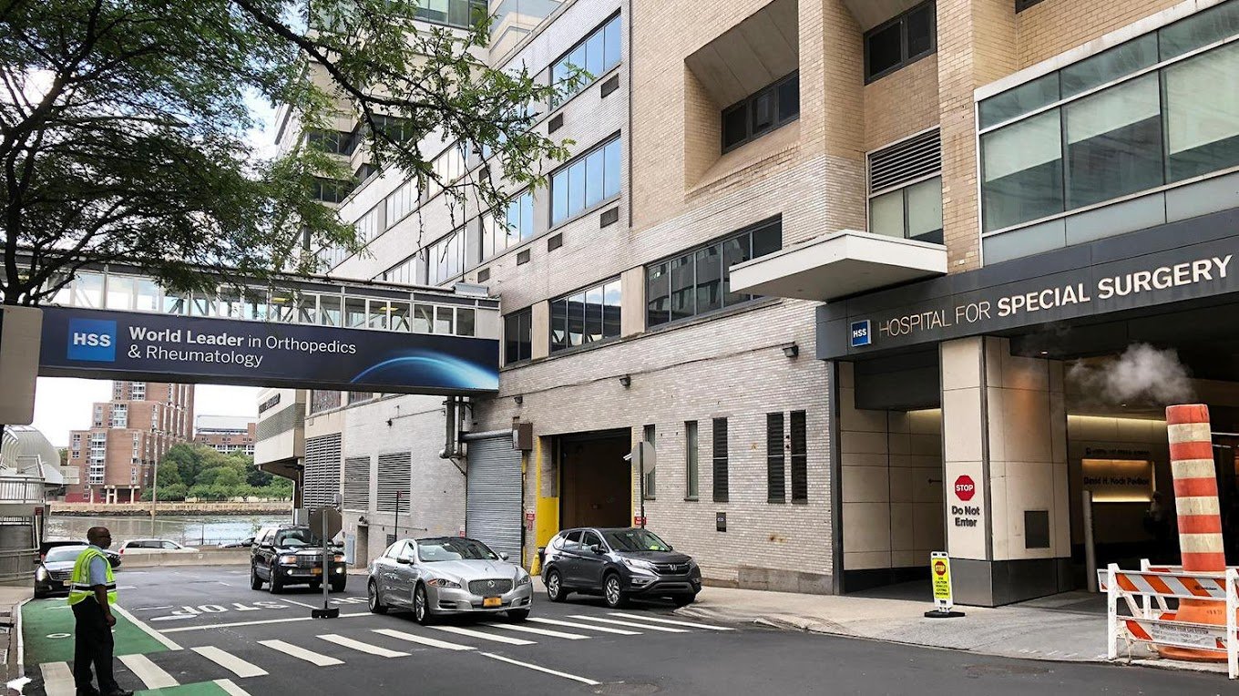 Hospital for Special Surgery entrance in New York City, sign indicating 'World Leader in Orthopedics & Rheumatology' and 'Hospital for Special Surgery'