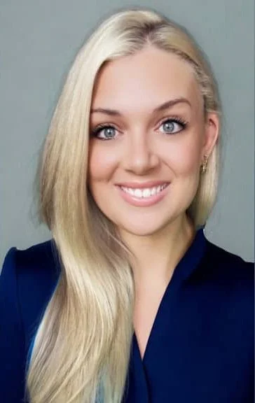 Headshot of a family nurse practitioner Alisa Kurth, smiling at the camera.