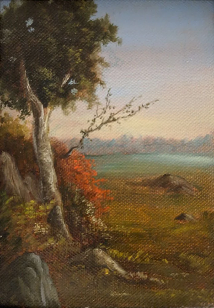 Oil painting of a landscape with a tree on the left, colorful bushes, rocks, and an open field with a distant city skyline under a clear sky.