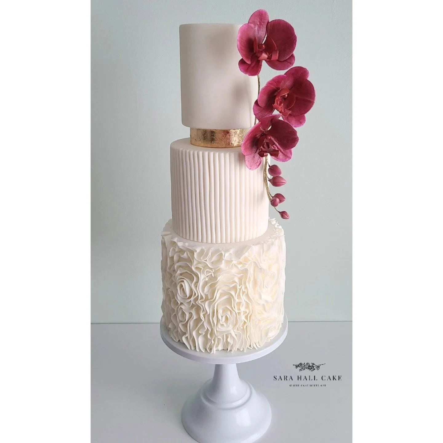 Flowing #sugarflower #orchids and buds on this #customweddingcake 
.
.
.
#ruffledflowercake #newenglandwedding #massachusettswedding #SaraHallCake #locallysourcedingredients #westernmasswedding #weddingcake #engaged #floralweddingcake #weddinginspo #