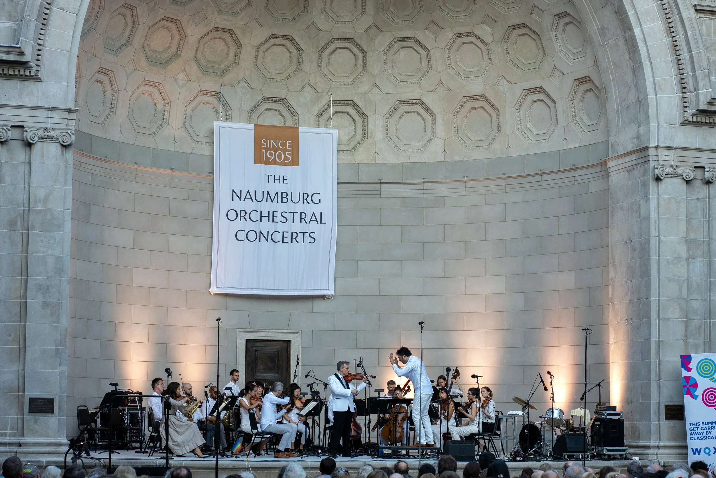 Photo of musicians performing at the Naumburg Bandshell in Central Park