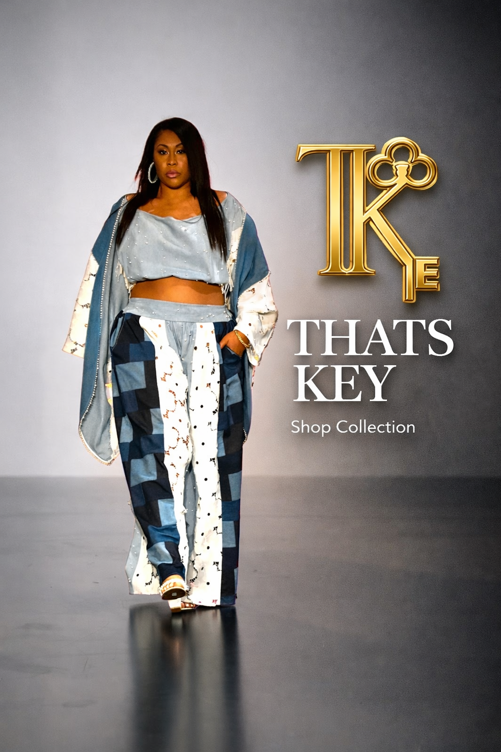 A woman walking on a runway, wearing a blue and white patterned outfit and large earrings, with text on the right side that reads 'TAHTS KEY Shop Collection' and a gold logo with the initials 'TKE'.
