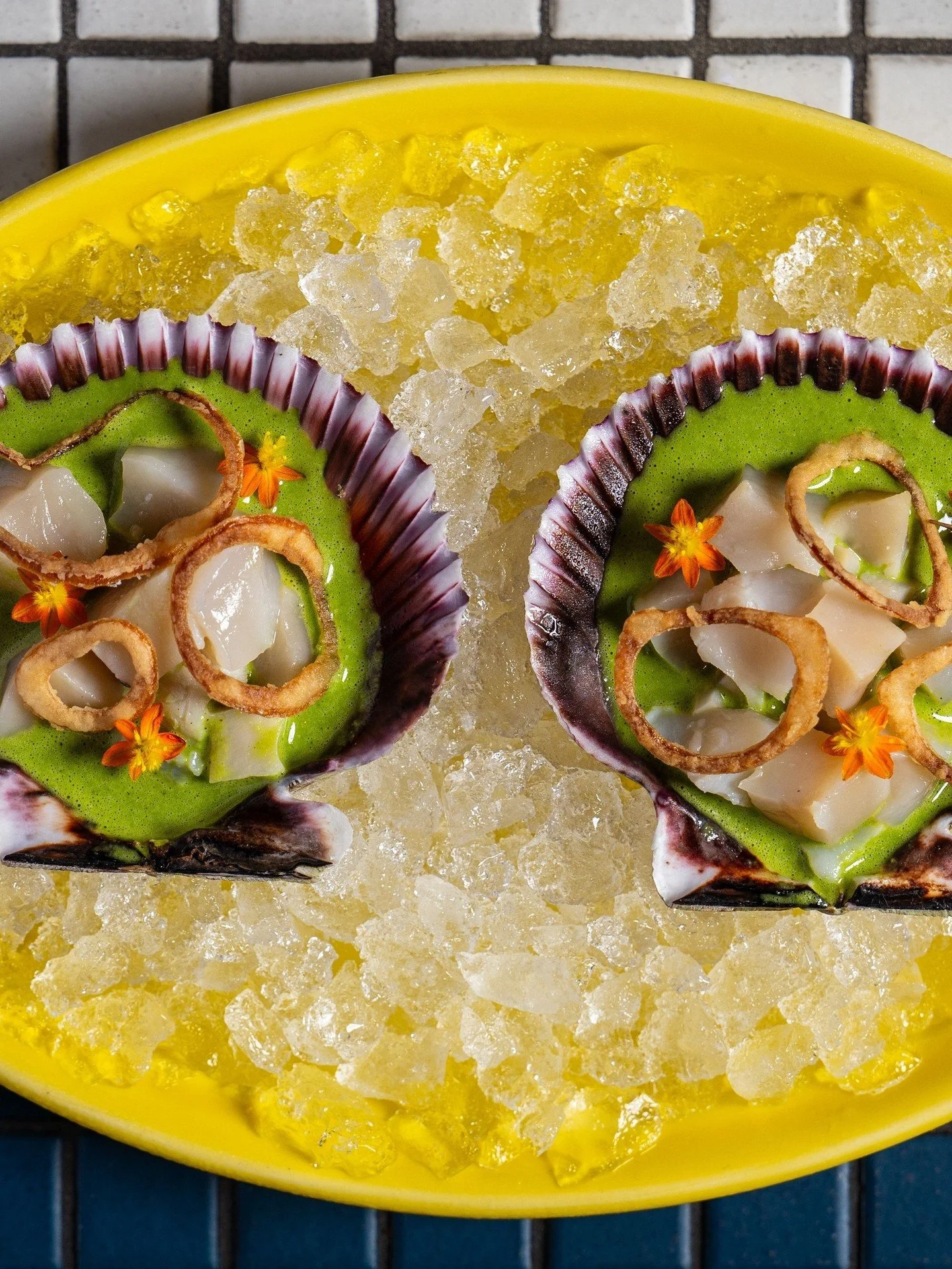 Good things come on the half shell. Scallop Aguachile with aguachile verde, crispy potato coral, and cilantro.