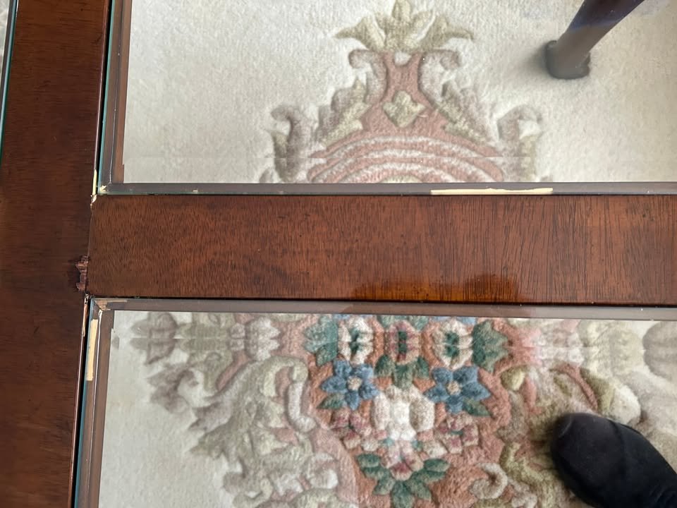 Solid Wood Coffee Table $99 OBO. Solid wood coffee table with glass inserts and beautiful detailing on feet. Good condition with some small flaws (pictured) that are easily repairable. Loved by its current owner but ready for a new home. Measuring