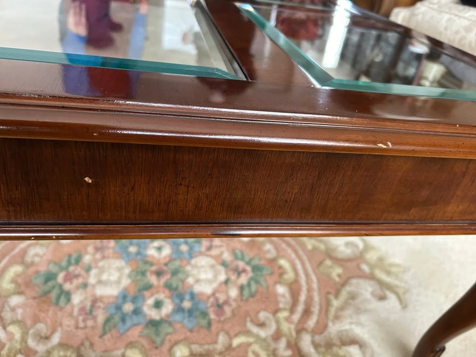 Solid Wood Coffee Table $99 OBO. Solid wood coffee table with glass inserts and beautiful detailing on feet. Good condition with some small flaws (pictured) that are easily repairable. Loved by its current owner but ready for a new home. Measuring