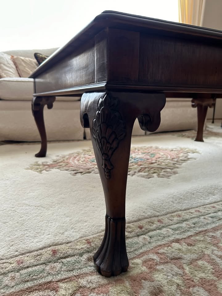 Solid Wood Coffee Table $99 OBO. Solid wood coffee table with glass inserts and beautiful detailing on feet. Good condition with some small flaws (pictured) that are easily repairable. Loved by its current owner but ready for a new home. Measuring