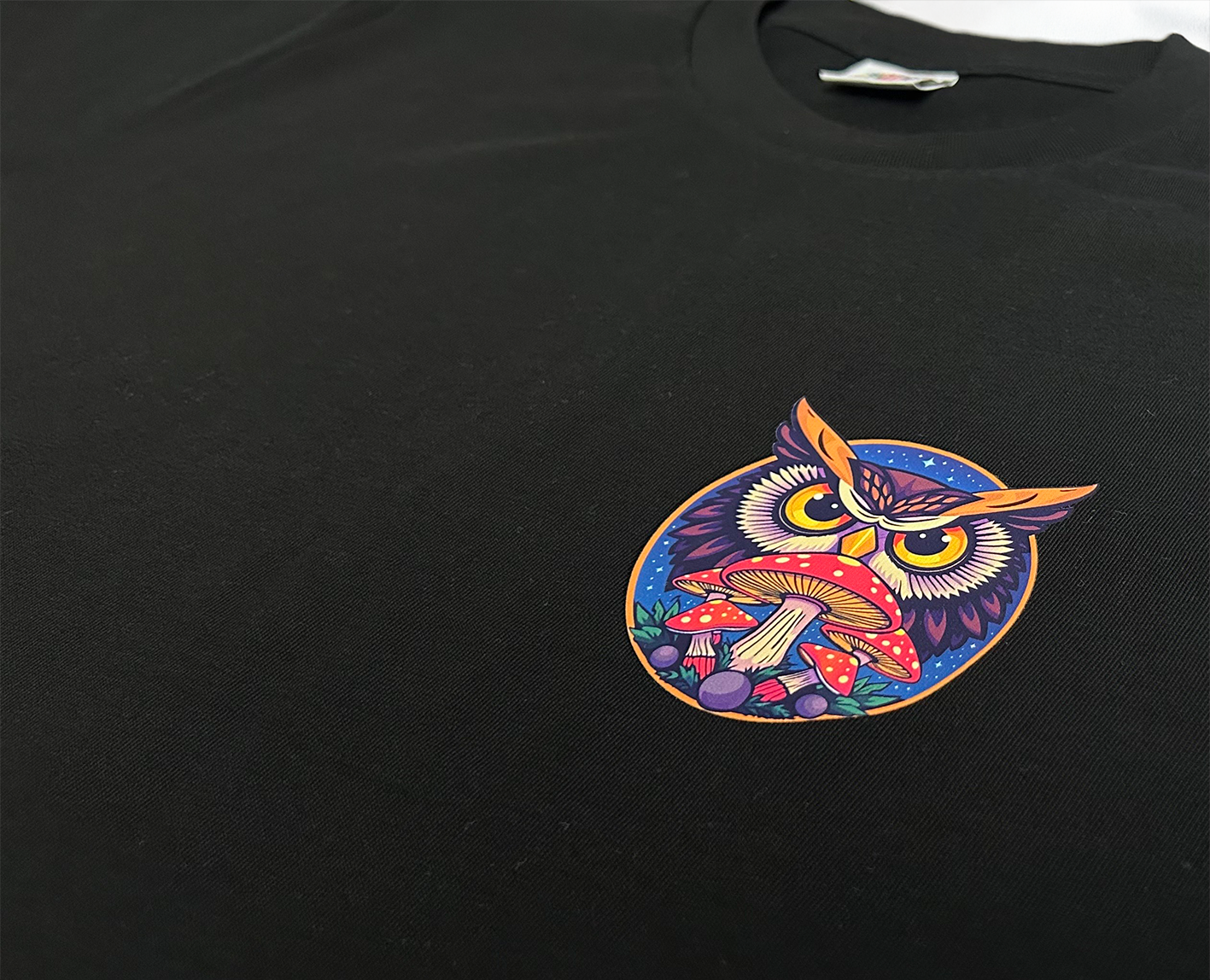 Black Psychedelic Owl Everyday T-shirt featuring a minimalist owl design – comfortable, unisex fit perfect for daily wear.