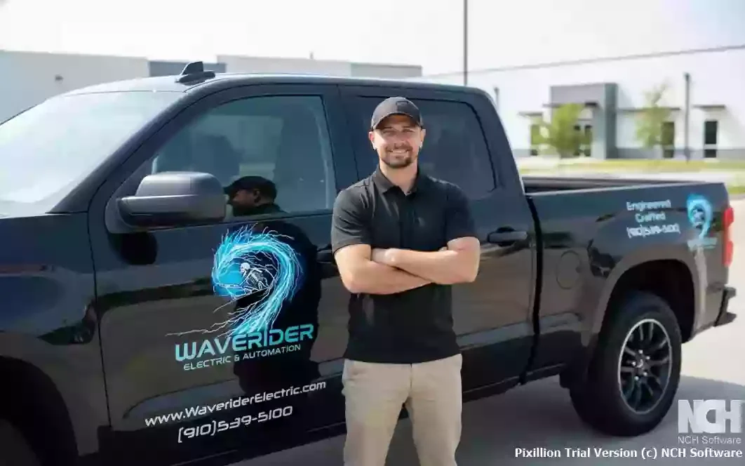 WaveRider Electric & Automation Owner Jason Wagner standing in front of a newly installed whole house generator in Wilmington NC
