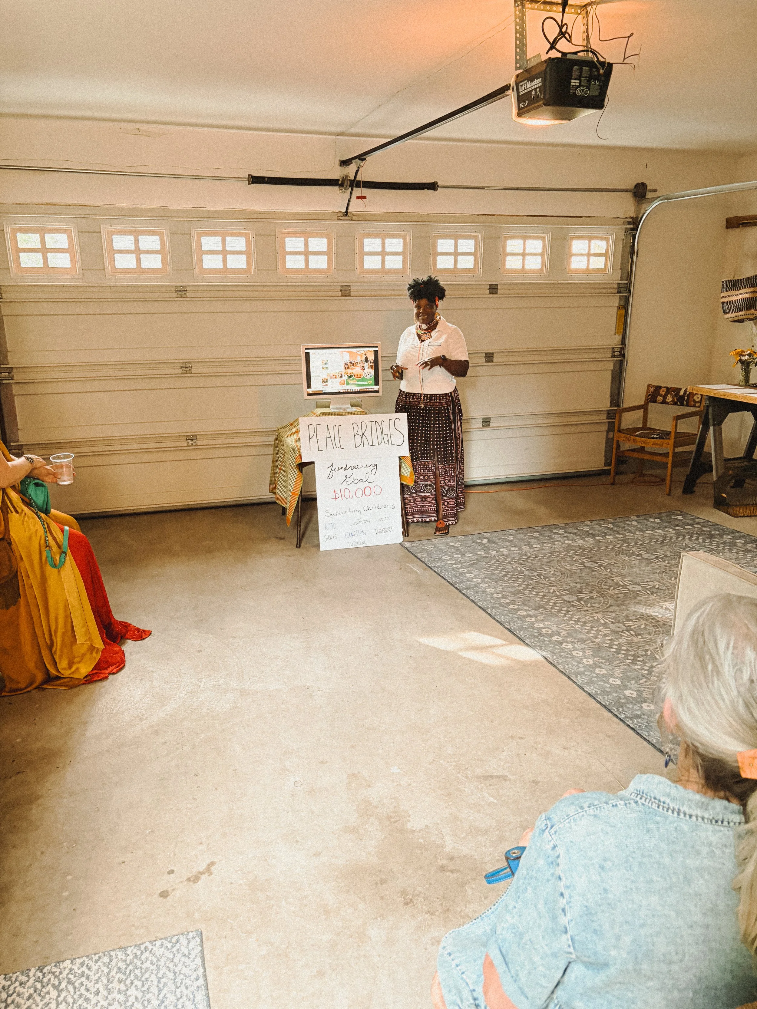 425-nw-state-street-bend-oregon-peace-bridges-board-member-speaking-garden-fundraiser..JPG
