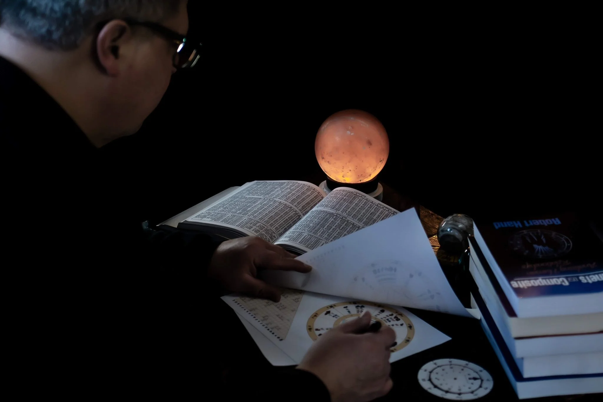 astrologer looking at charts