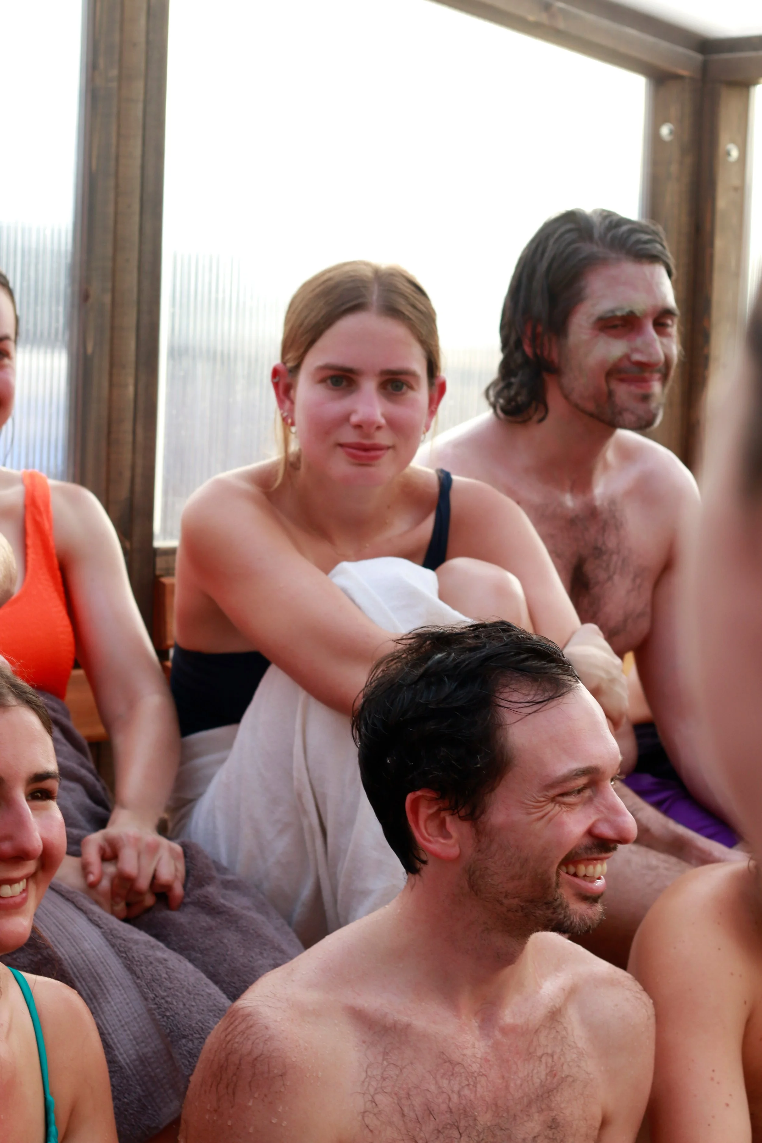 people enjoying sauna together