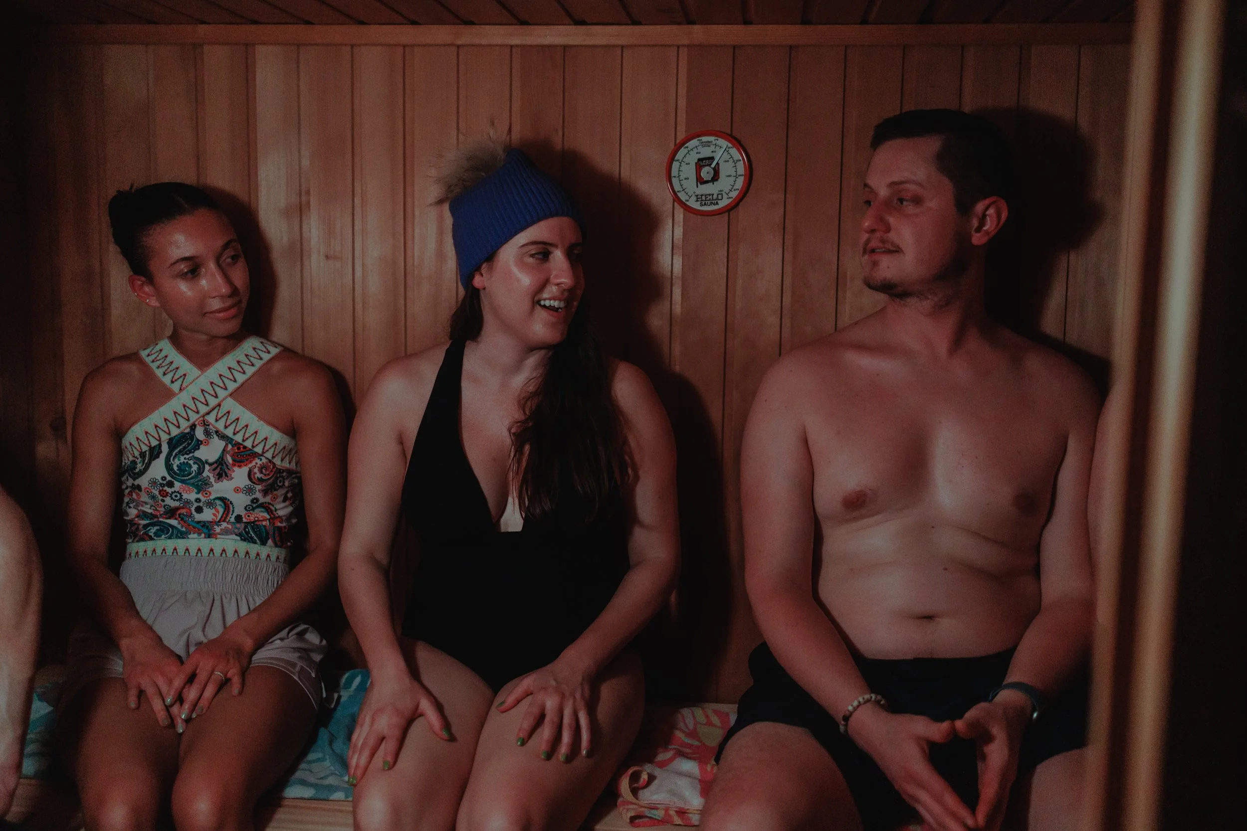 Three people enjoying a sauna