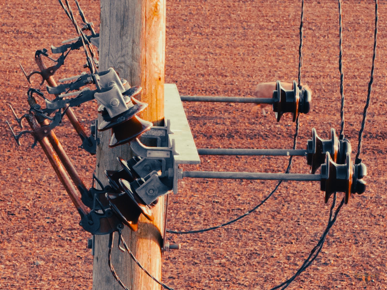 Close-up aerial macro image showing detailed powerline assets captured by Airsuv during a drone infrastructure inspection. This precision UAV survey highlights conductor fittings and insulator components with exceptional clarity — part of our nationw