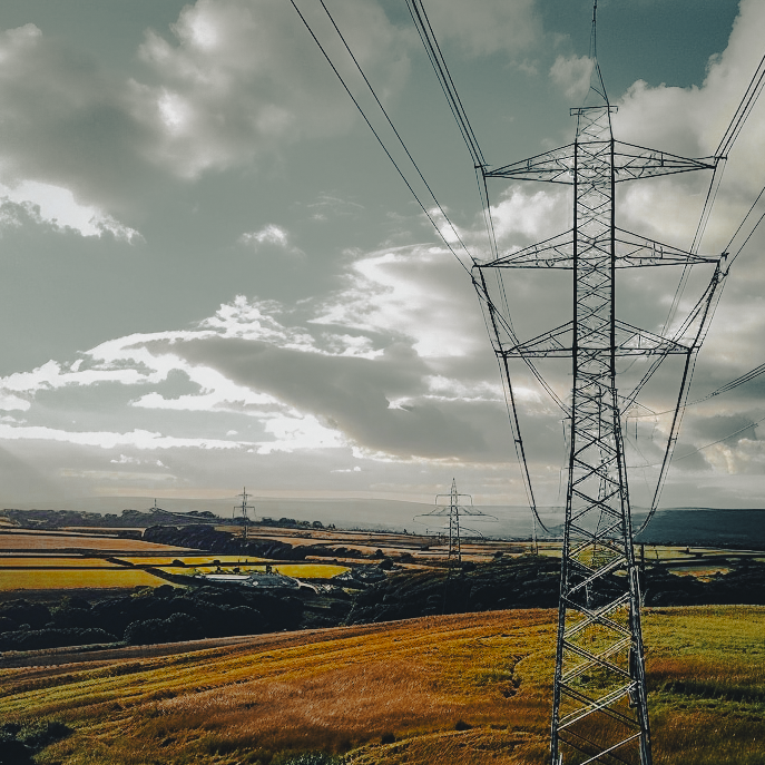 High-voltage powerline inspection photographed by Airsuv using drone imaging across rural Yorkshire.
