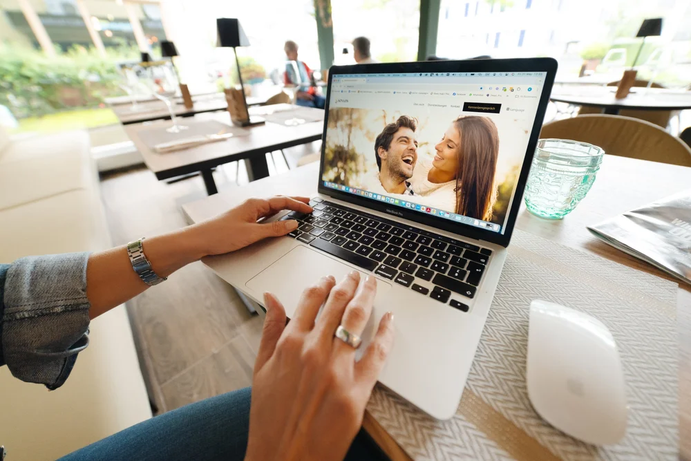A parent joining a live online session on a laptop